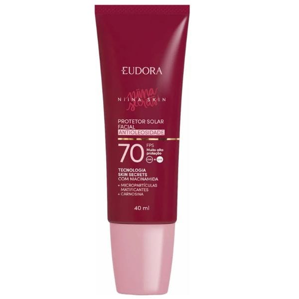 Protetor solar facial Eudora Niina Skin FPS 70, embalagem vinho e rosa claro com 40ml, ação antioleosidade e alta proteção UVA/UVB.